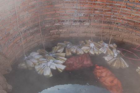 cooking bamboo shoots in the very hot springs