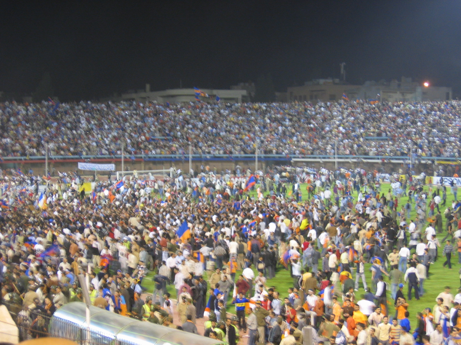 Homs fans rushing the field