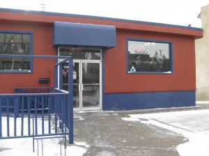 Terra cotta building with blue trim