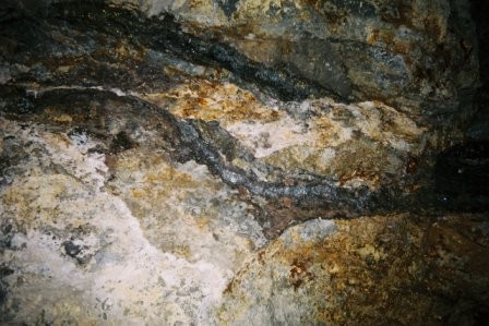 Lines of minerals along the wall of the tunnel