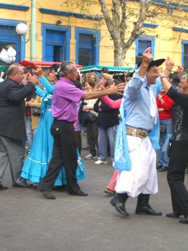 Locals dancing passionately at the Feria de Mataderos