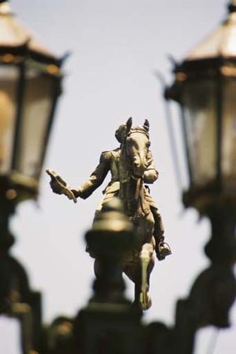 Majestic statue and ornate lamp-posts