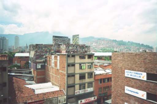 View of the slum-areas up the surrounding hills from one of Medellin's metro stations
