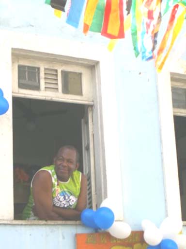 Watching the parade comfortably from his balcony